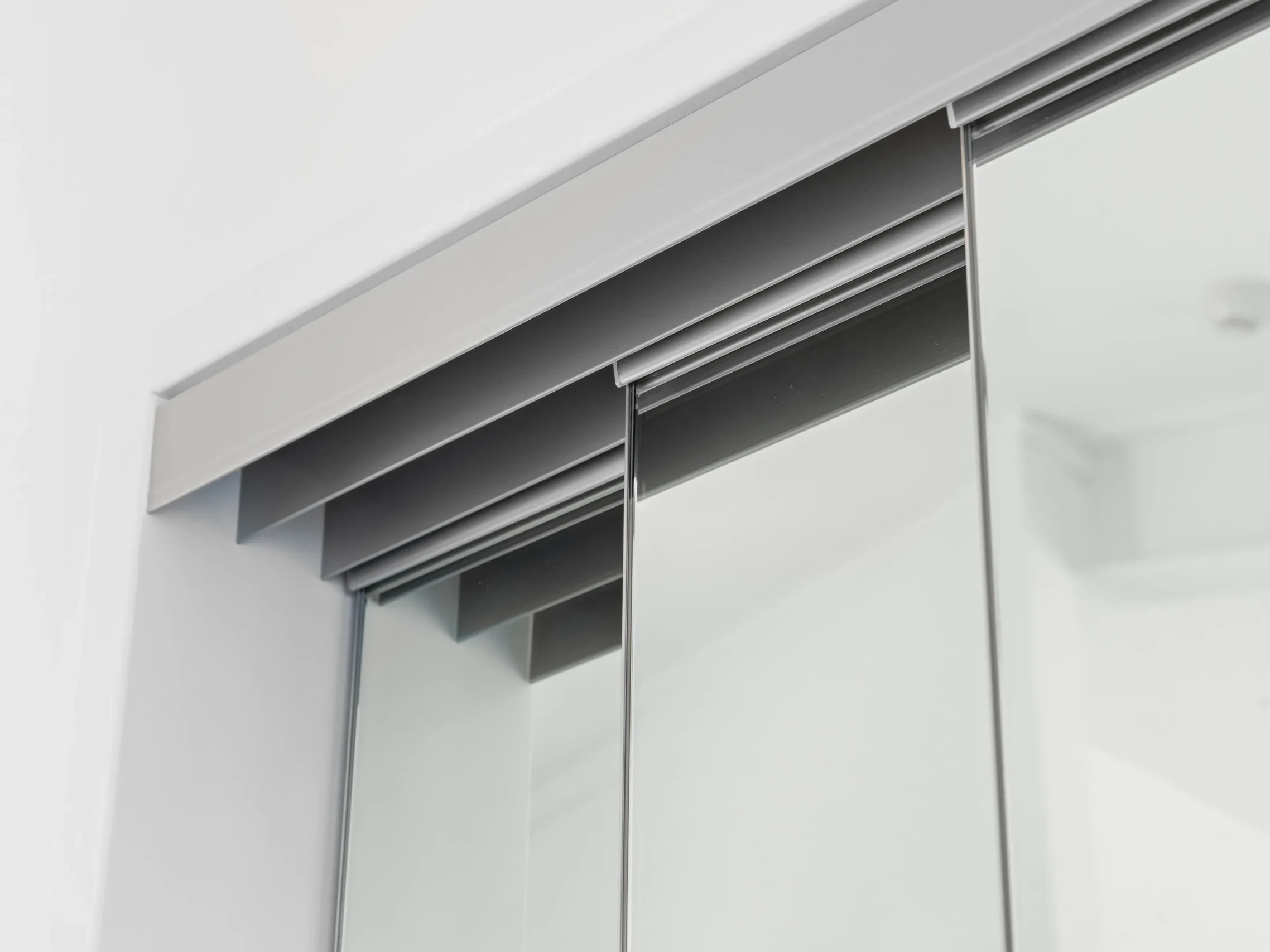 Frameless-Mirror-Sliding-Doors-top track detail