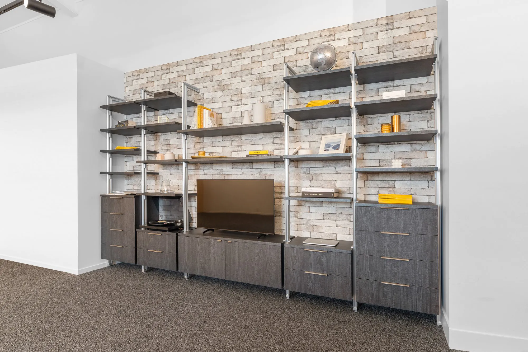 Living room cabinetry with shelving, cupboards and drawers