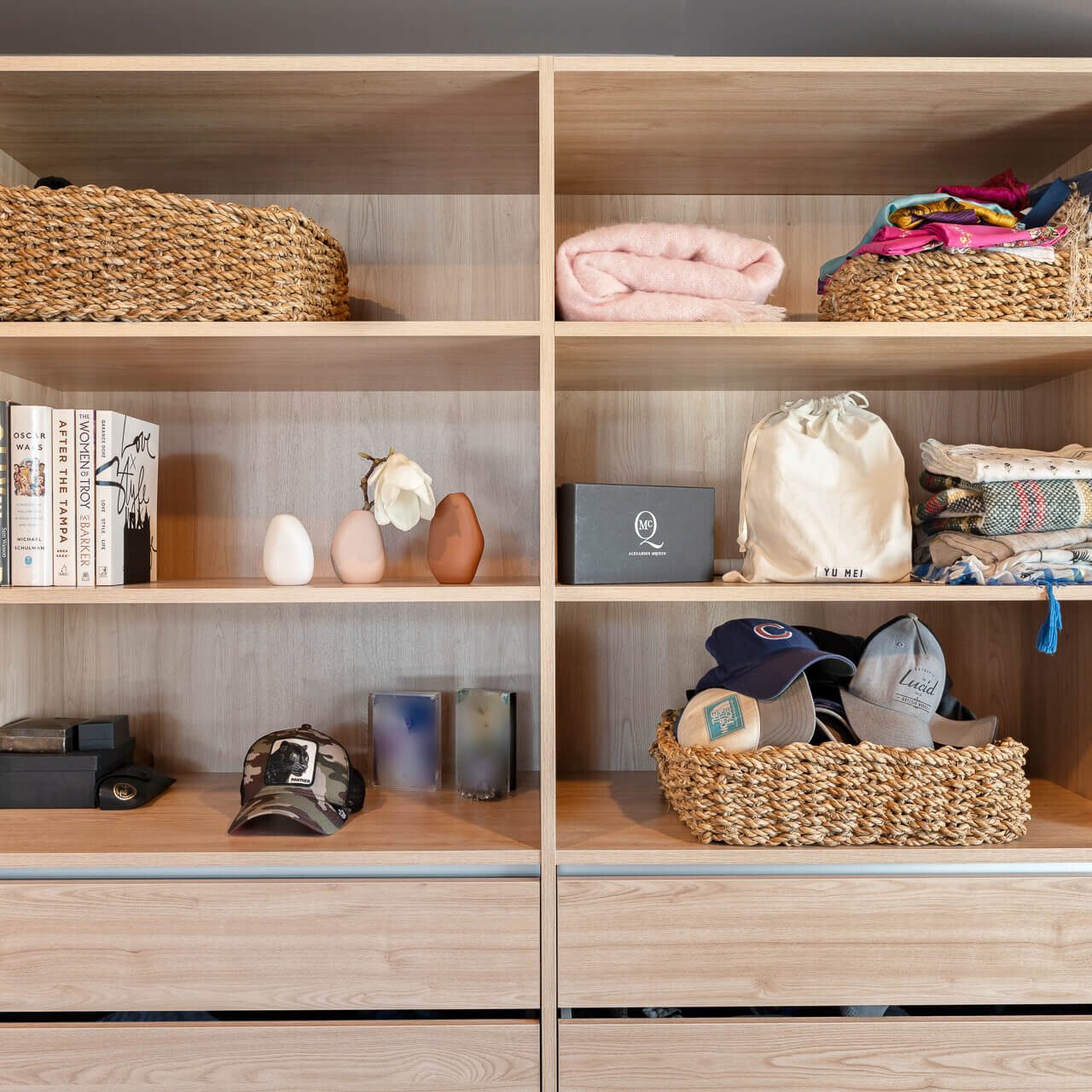 Luxe walk-in wardrobe organiser in light woodgrain colour, close up of shelving space